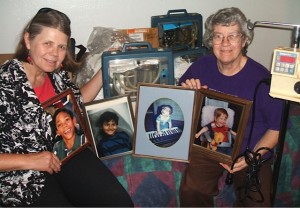 Lynne and Marian with photos of Coco, Raymond,Ilan and Derek