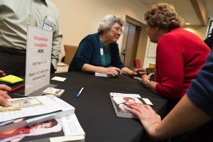 Marian autographing copies of Derek